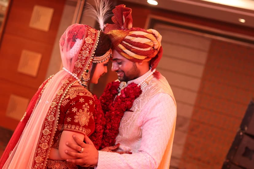 Bride and groom sharing an intimate forehead embrace at their Noida wedding