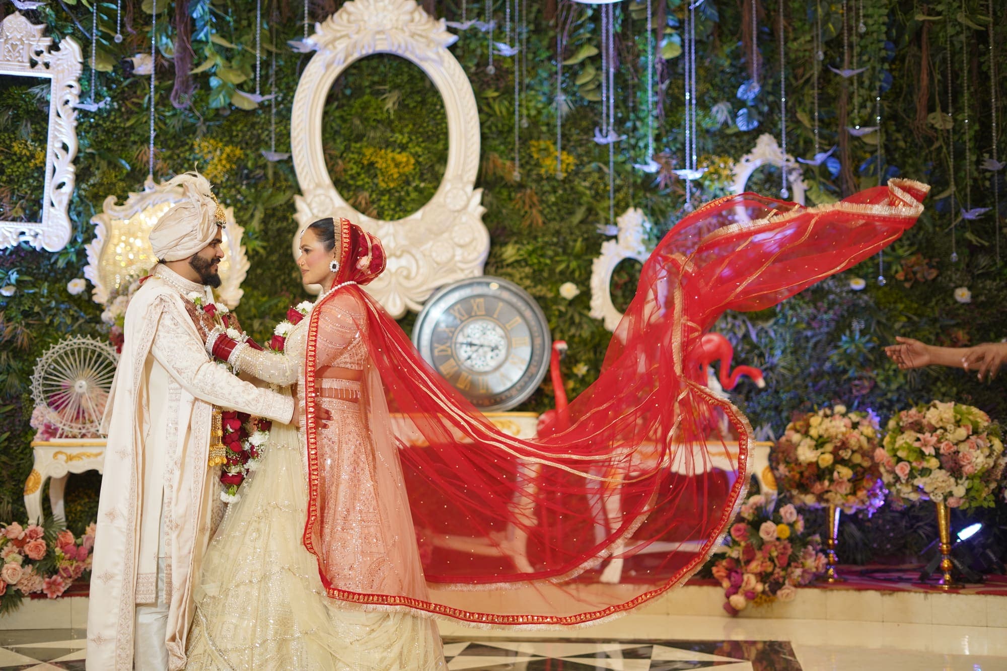 Bride's dupatta flowing dramatically at a Noida wedding venue