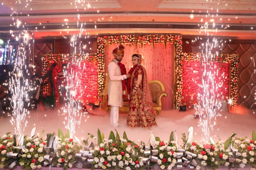 Couple celebrating with fireworks on the wedding stage